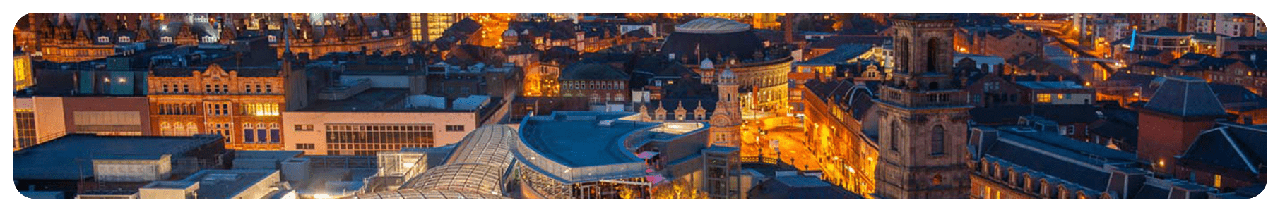 leeds cityscape at dusk with lit buildings