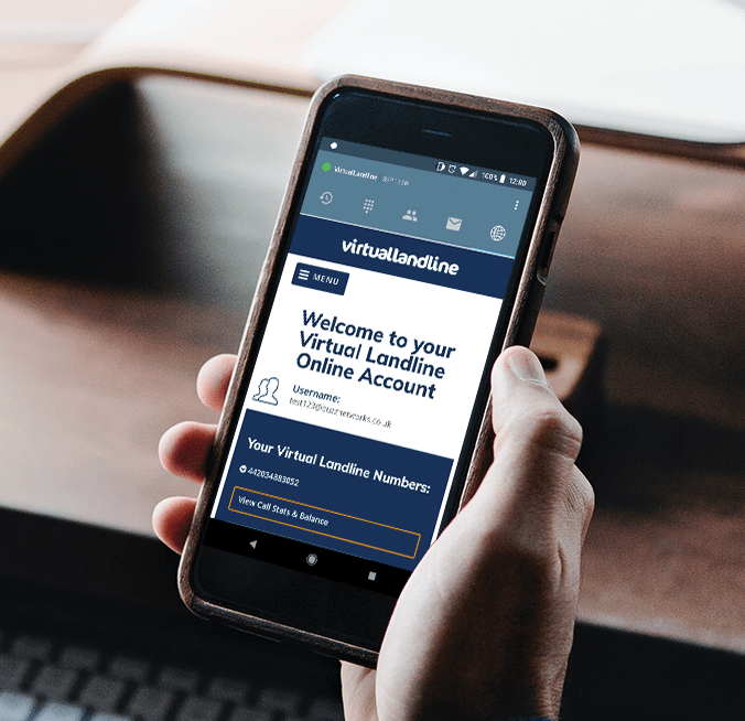 Hand holding a smartphone showing a Virtual Landline online account page
