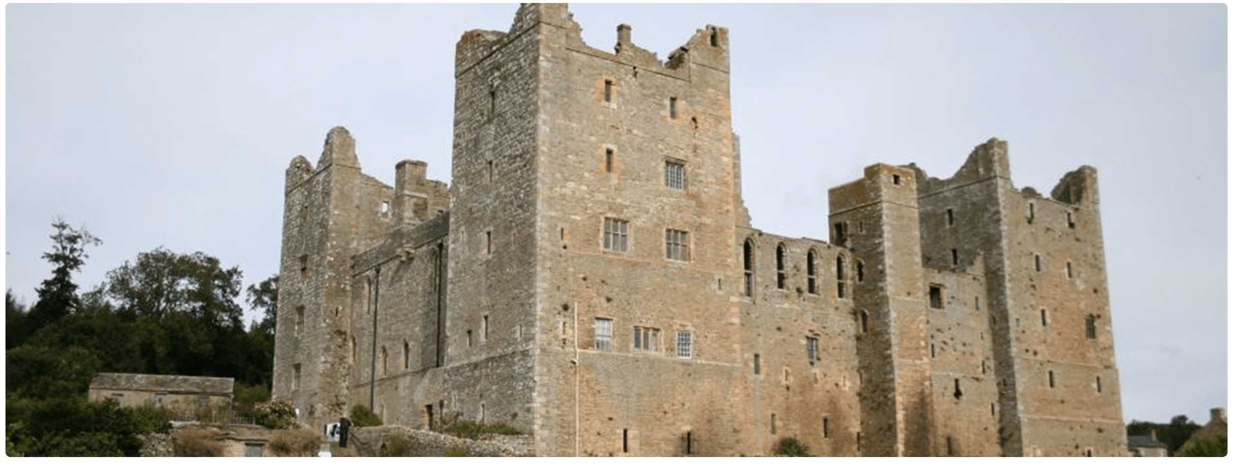 Medieval stone castle with tall towers and battlements.